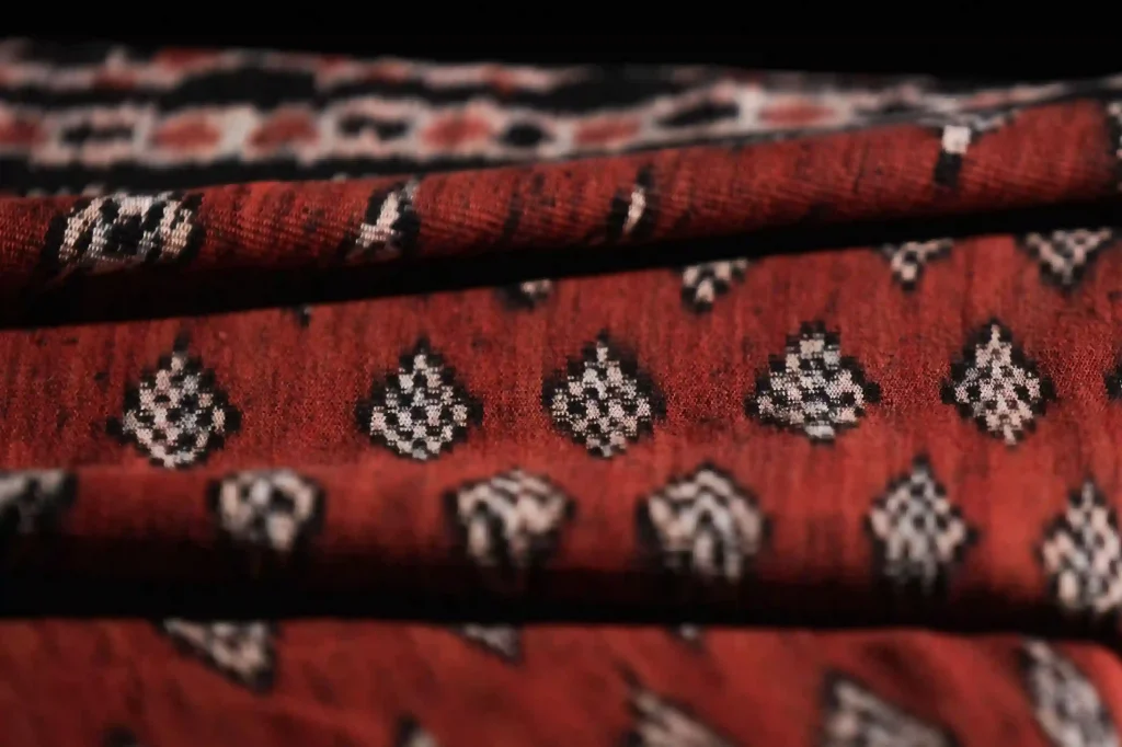 Folded red and black Sumba ikat tenun with diamond motifs