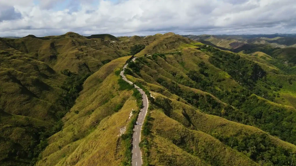 Road winding across the green Tanarara Hill