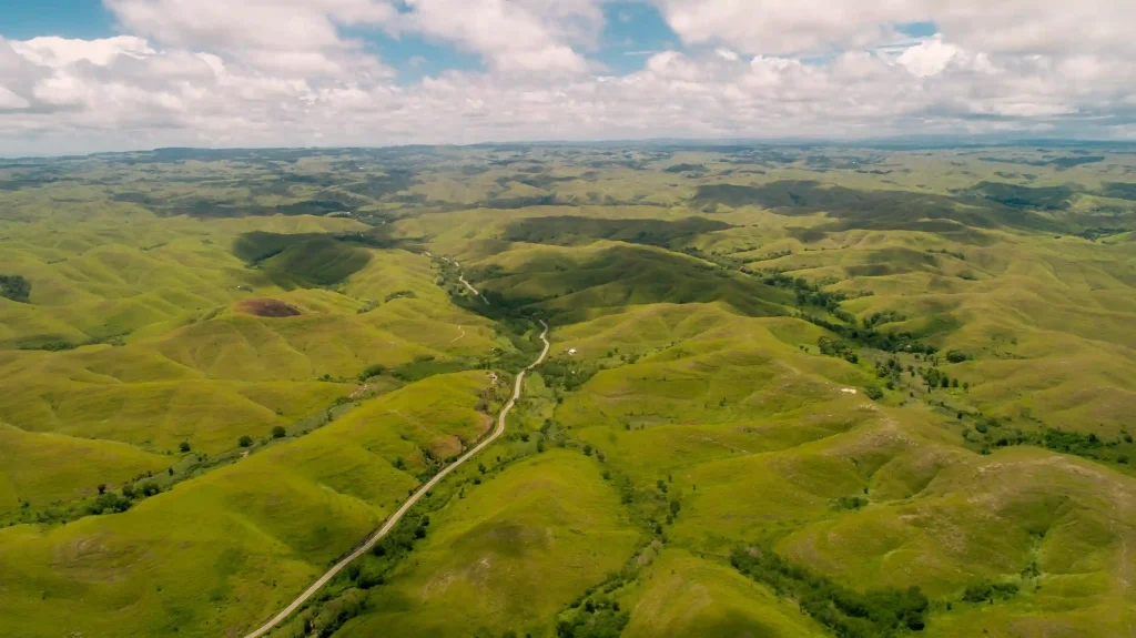 Wide green landscape of Tanau Hill