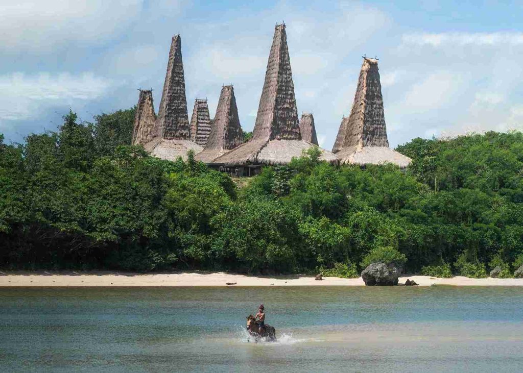 Peaked roofs of Ratenggaro Village seen across the river